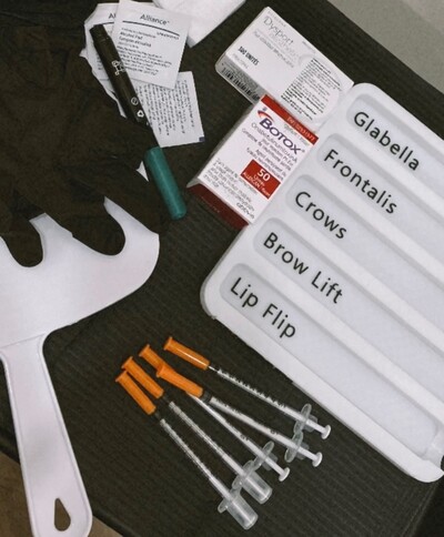 Botox and Dysport injection setup with labeled treatment tray, syringes, and supplies at SolSkinn Medical Aesthetics.